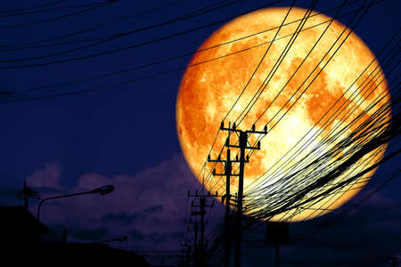 super full blood moon back silhouette power electric lineの写真素材