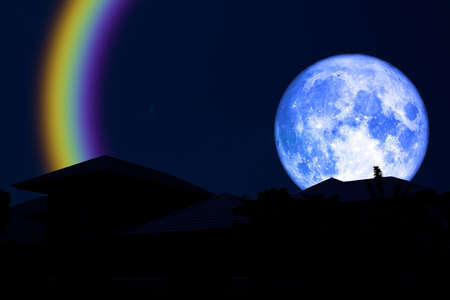 full blue moon halo back over silhouette roof
