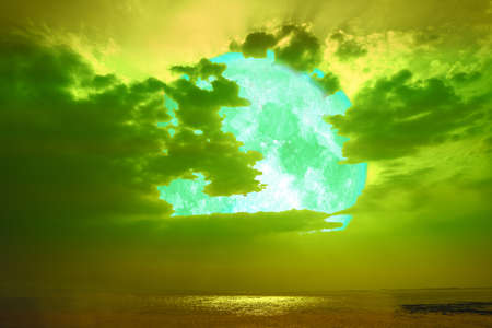 full sturgeon moon silhouette on the sea skyの写真素材