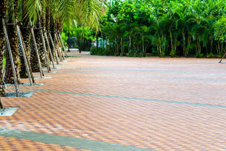 pattern of brick wall on paving floor near playground in public parkの写真素材