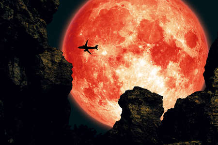 super long night moon, cold moon back between two mountain night sky