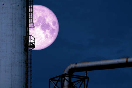 cold moon back silhouette refinery oil tankの写真素材