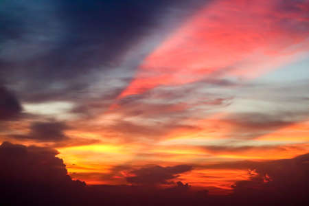 flame colorful cloud and evening sky and ray of last light of sunsetの写真素材