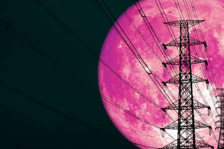 super pink moon back silhouette power electric pole and night heap cloud on skyの写真素材