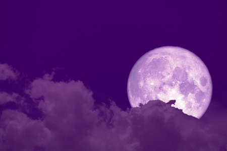 hunger moon back on silhouette heap cloud on sunset skyの写真素材
