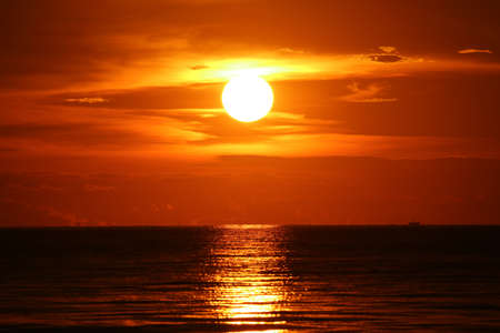 sun dawn back on morning sky silhouette cloud sunlight on seaの写真素材