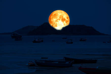 super blood moon back on silhouette island sea on night skyの写真素材