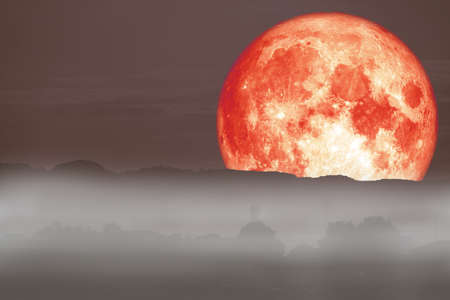 full red fish moon back on cloud and fog on mountain night sky, Elements of this image furnished by
