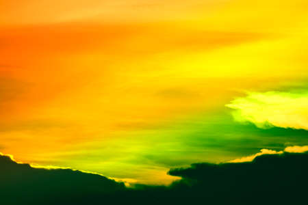 multicolor heap giant orange sunset cloud and dark sky background
