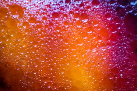 colorful dark and shadow of oil surface background after fried meal and fish. Oil is poured into the...