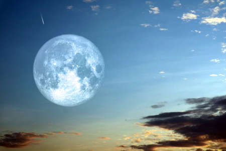 Full hay moon and silhouette white cloud night skyの写真素材