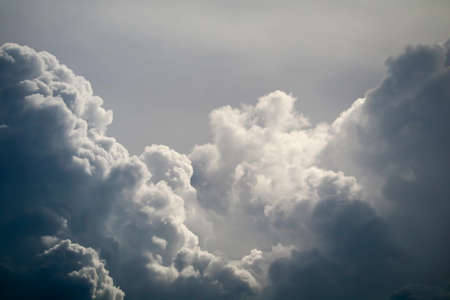 storm silhouette heap cloud sun ray in gray skyscape dark cloud backgroundの写真素材