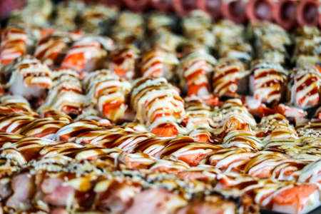 sushi ham and shrimp and seafood and wakame sweet egg on street food in pattaya city of thailandの写真素材