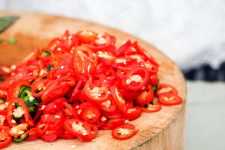 Popular sliced red and green chilies are mixed with seasoning for eating with Thai foodの写真素材