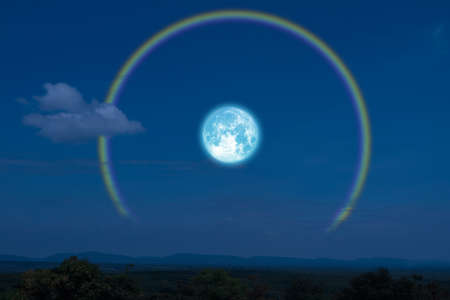 Full flower Moon halo back silhouette mountain and riverの写真素材