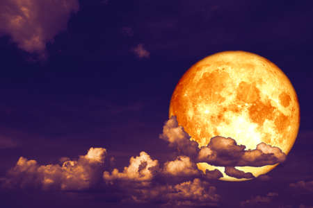 blood strawberry moon back on silhouette heap cloud on sunset skyの写真素材