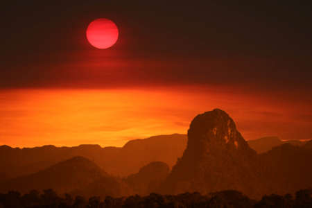 sunset colorful back on cloud and fog on mountain and hill night skyの写真素材