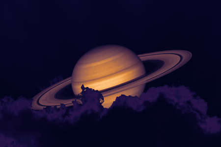 Saturn on night sky back silhouette mountain and heap cloudの写真素材
