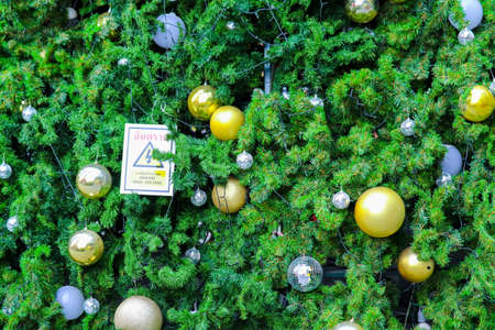 part of Christmas tree has green leaves and decorated with various items to celebrate Christmas...