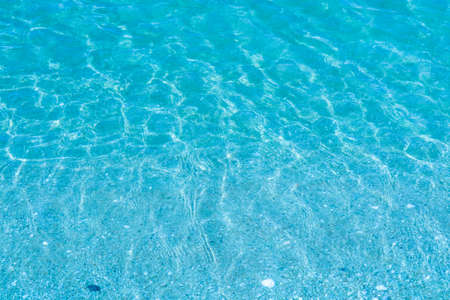 The water is so clear that you can see the sand and shells in the water, This phenomenon will occur in the winter and summerの写真素材