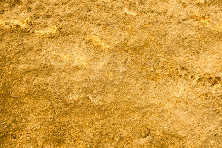 ancient honey granite stone surface of cave for interior wallpaper and background