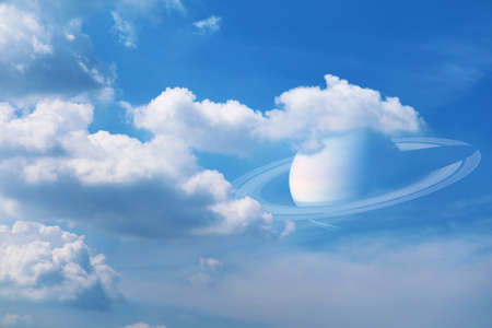 Saturn back on pure white heap cloud and sunlight shining and pass on clear blue sky in summer seasonの写真素材