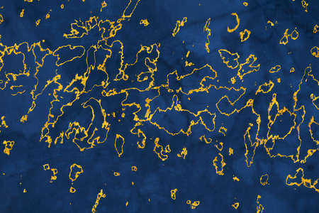 mineral gold on dark blue marble surface of cave for interior wallpaper and background