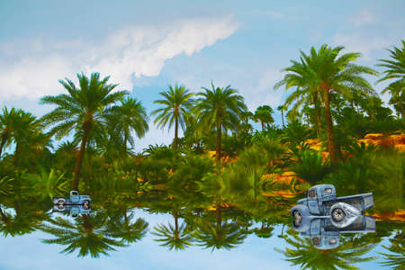 reflection car was parking on water on of lake and blue sky and white cloud in forest background