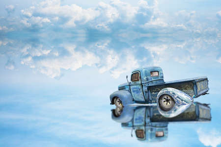 reflection car was parking on water on of lake and blue skyの写真素材