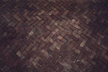 Ancient of pattern dark and light tone brick floor pavement stones on walkway