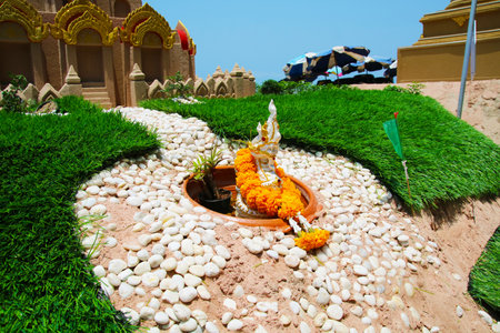 sand pagoda and naga in Songkran festival represents In order to take the sand scraps attached to the feet from the temple to return the temple in the shape of a sand pagodaの写真素材