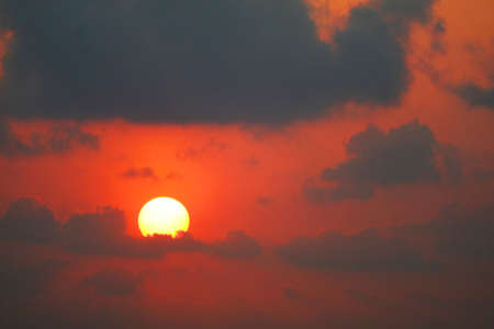 beautiful sunset orange yellow red silhouette gray sky in back on the cloud