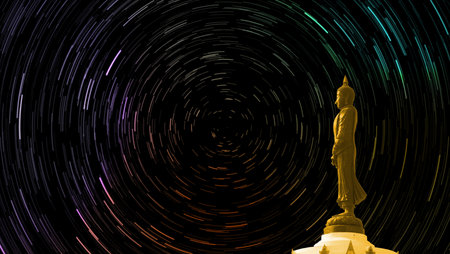 star trail on the sky back Buddha looking seven day style standing statusの写真素材