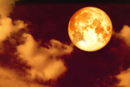 full corn blood moon and white gray silhouette cloud sky in the night skyの写真素材