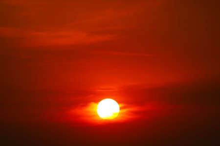 beautiful orange yellow red silhouette sky in sunset back on the cloudの写真素材