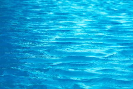 water near beach is so clear that you can see sand and shells in the waterの写真素材