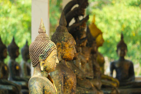 ancient buddha many style have rust and erosion on skin texture on outdoorの写真素材