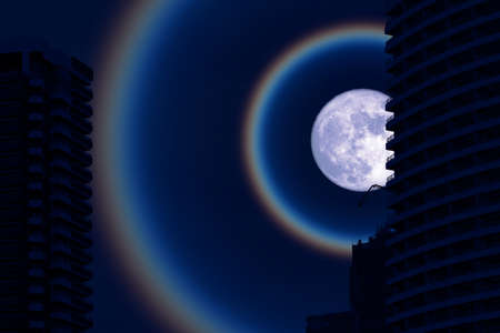 super fruit blue moon corona back silhouette building on the night skyの写真素材