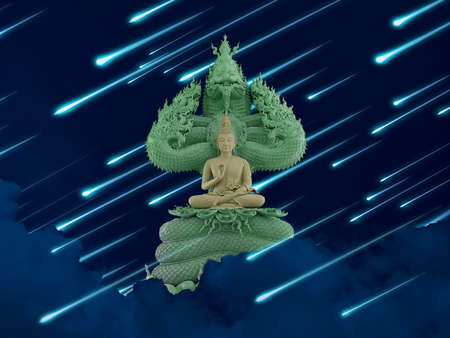 Buddha protected by hood of mythical king naga and meteor rain on the night skyの写真素材