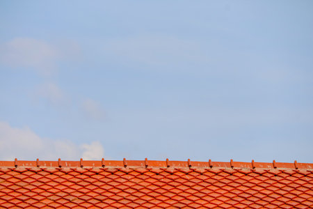 Roof on top and blue sky white cloud background. Pattern of roof. tile top protectionの写真素材