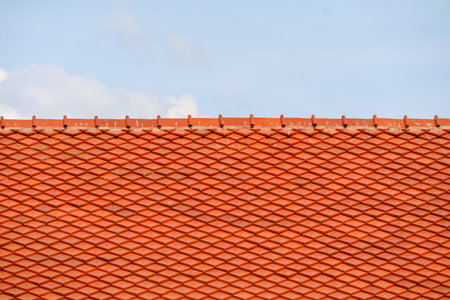 Roof on top and blue sky white cloud background. Pattern of roof. tile top protection