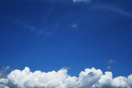pure clear blue sky huge white gray cloud and sunlight.jpgの写真素材