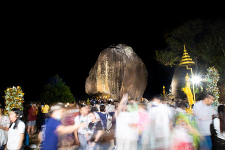 Holy stone on Buddha of footprint worship festival at the top of Khichakut mountain and night sky. people come to blessingの写真素材