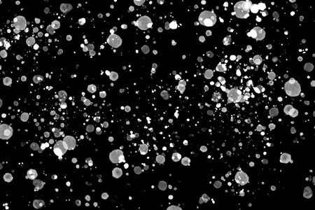 abstract ice and dust explosive in the air on black isolatedの写真素材