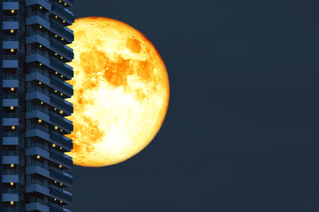 super grain moon back silhouette building on the night skyの写真素材