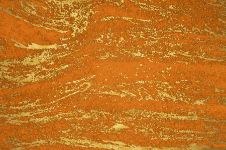 gold mineral and orange hard granite marble luxury interior texture surface backgroundの写真素材