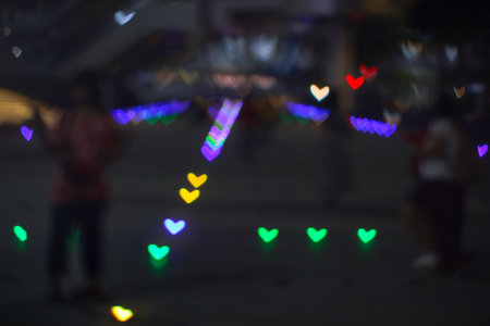 rainbow bokeh and blur heart shape love valentine colorful night light on floor