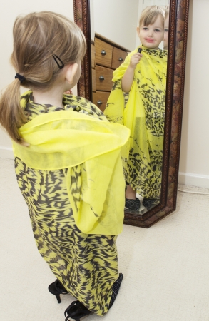 preschool girl playing dressing up の写真素材