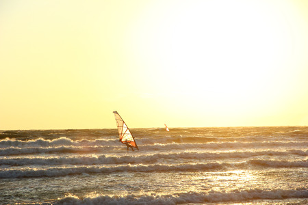Surfers in beautiful sunset. の写真素材