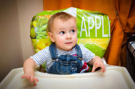 Child at the table during dinner 